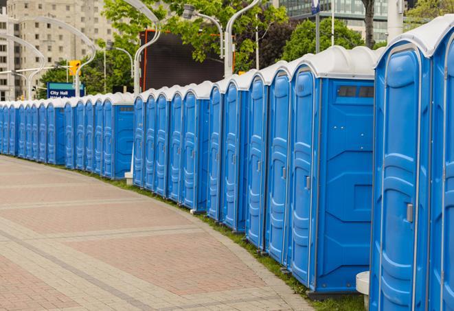 a row of portable restrooms ready for eventgoers in Forest City, FL